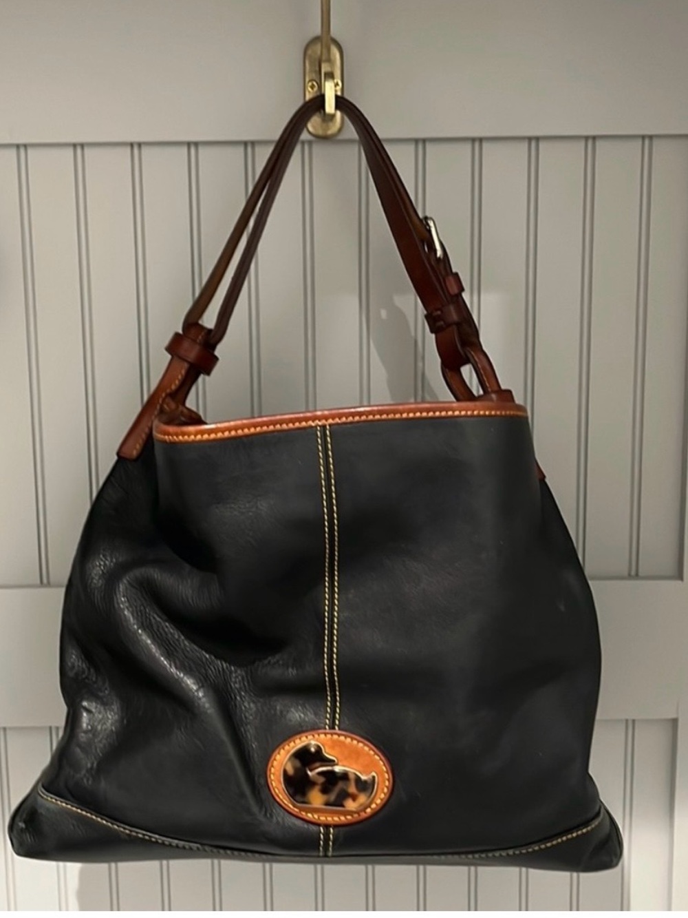 Dooney & Bourke Black Leather Hobo with Brown Trim and Tortoiseshell Accent